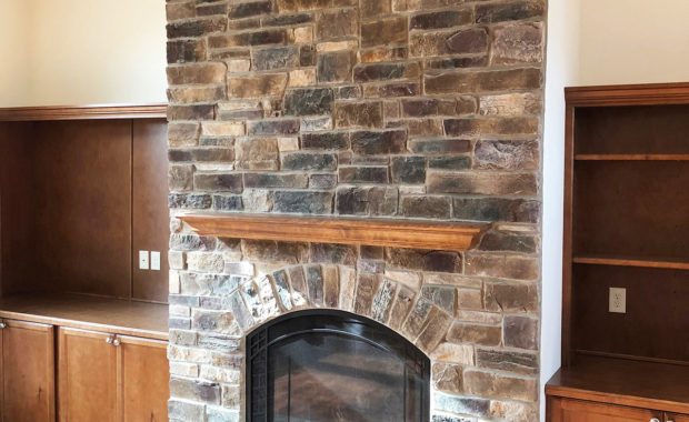 fireplace with stone surround