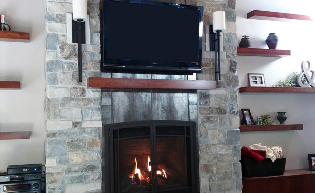 gas fireplace with tile and stone surround
